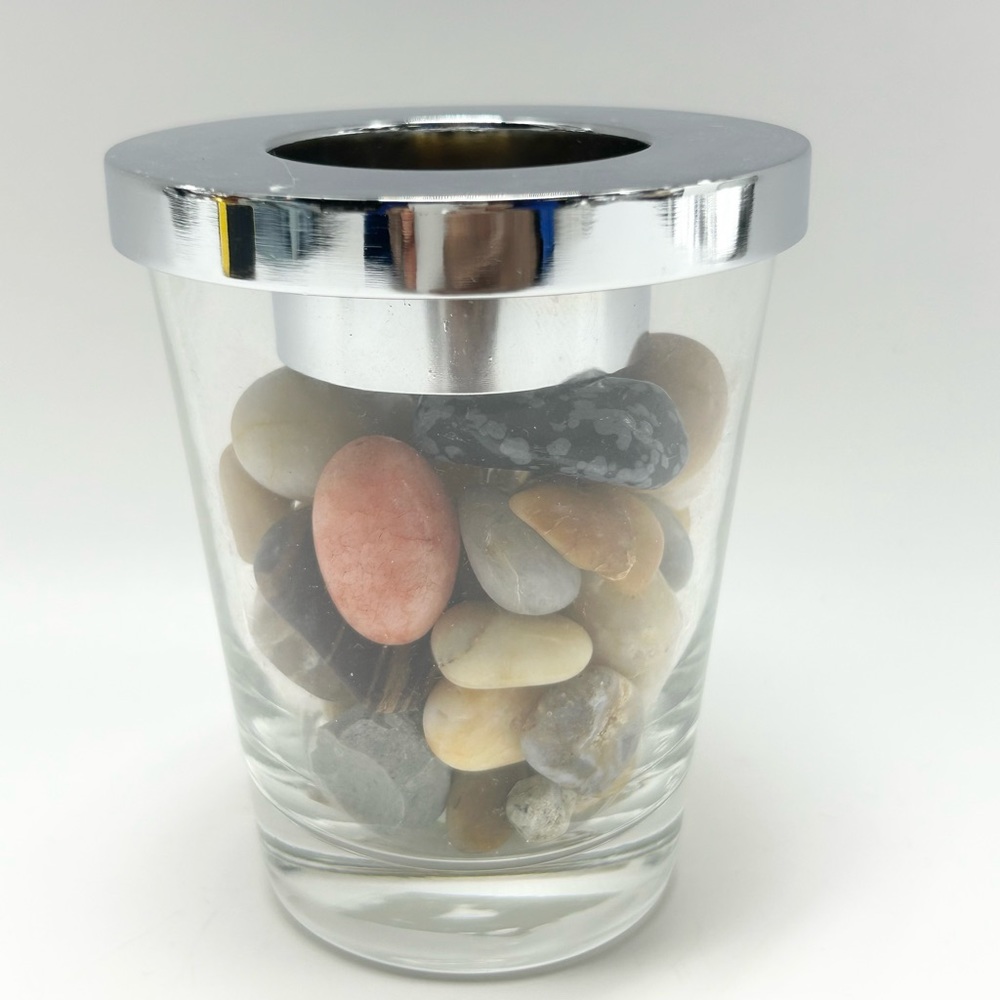 PartyLite - Glass container with stones.